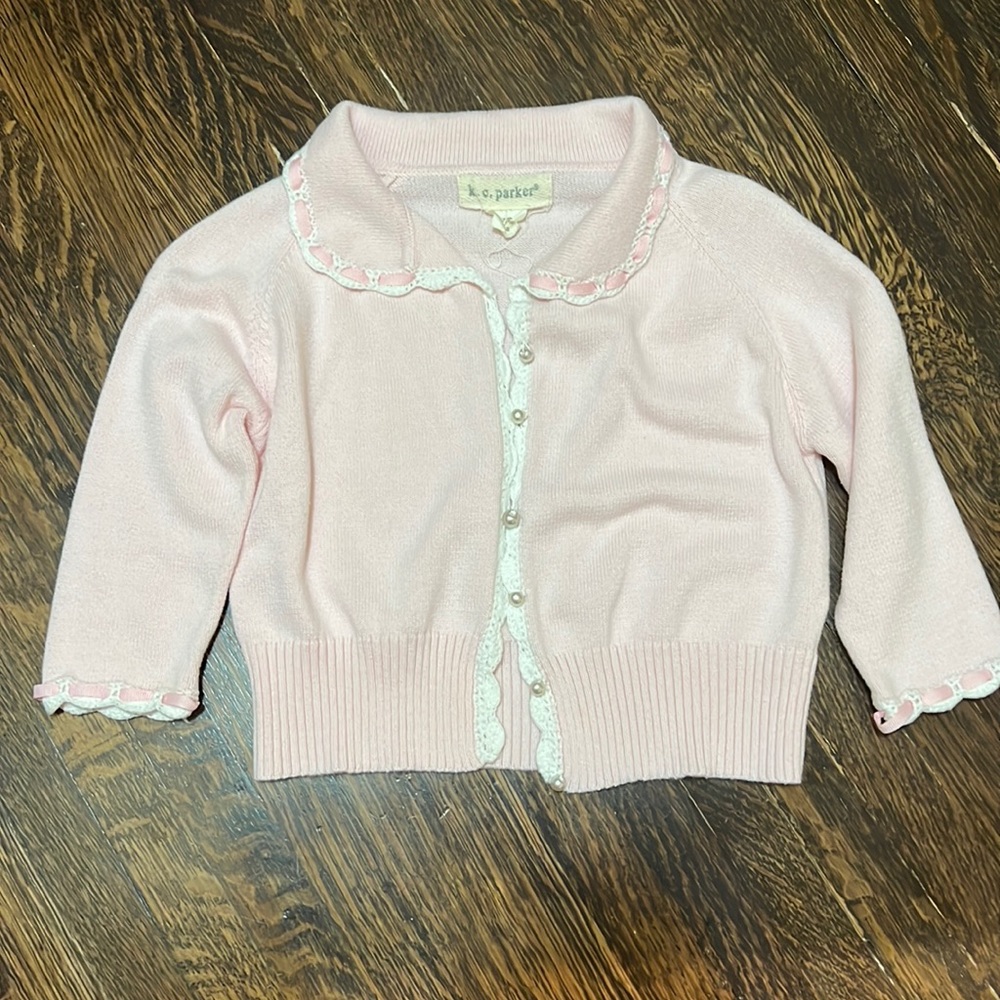 Pink and white cardigan with pearl buttons
